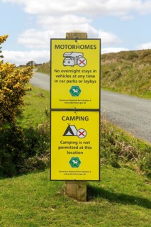 Signs warning of restrictions on camping and overnight stays in motorhomes