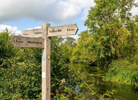 Wooden distance direction signpost