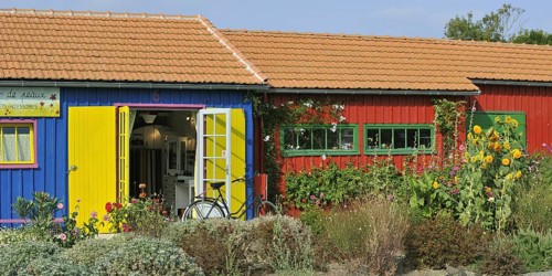 Colourful cabins of oyster farmers renewed and converted into arts and crafts shops at the harbour of Le Chateau-d'Oleron on the island Ile d'Oleron
