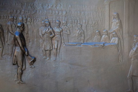 An engraving on the Wellington Monument shows The Duke of Wellington receiving gratitude before the House of Commons in 1814. Picadilly