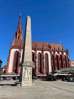 Gothic Lady Chapel on the market square with fountain obelisk