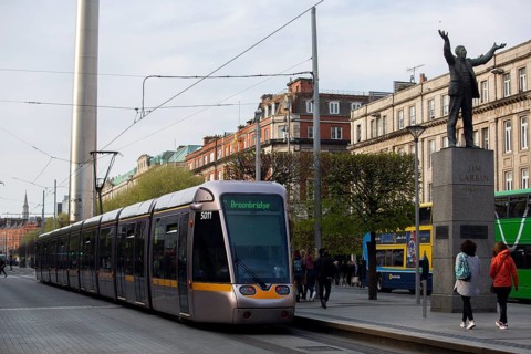 A Luas tram in O'Connell Street with pedestrians visible too. Dublin