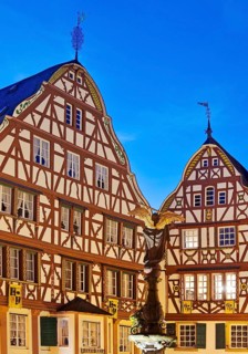 Gabled half-timbered houses on the medieval market square in the evening