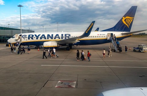 View through plane window Ryanair Boeing 737-8AS plane 9H-QAV London Stansted Airport