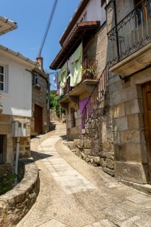 Narrow street historic houses in village of Pazos de Arenteiro