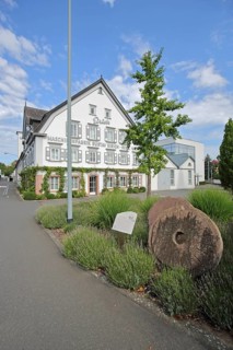 Historic building of the Gustav Eirich company with millstones