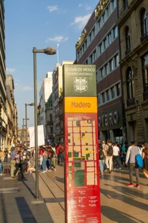 Crowd of people on pedestrianised street Avenida Madero