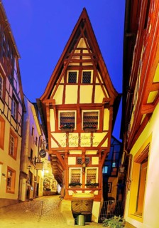 Pointe house on the medieval market square in the evening