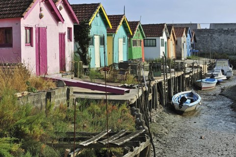 Colourful cabins of oyster farmers in the harbour at Le Chateau-d'Oleron on the island Ile d'Oleron
