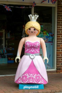 Giant Playmobil princess or queen model outside toy shop