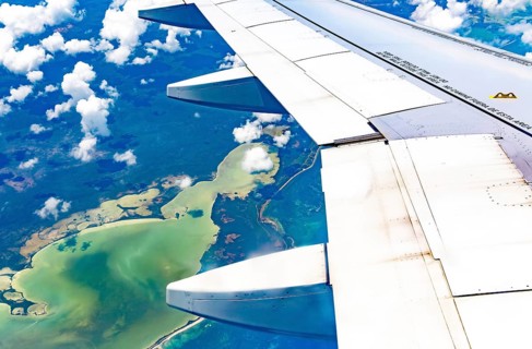 Oblique angle aerial view through plane window over Laguna Chunyaxche