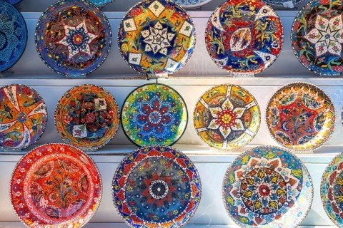 Souvenir shop with the sale of colorful plates in the city of Gjirokaster or Gjirokastra. Albanian
