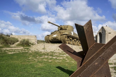 Czech hedgehog and M4 Sherman tank in front of the Musee du Debarquement Utah Beach