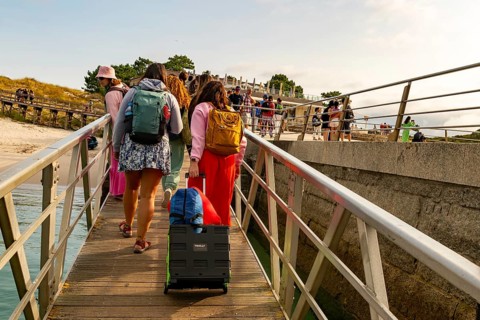 Passengers arriving at ferry terminal pier