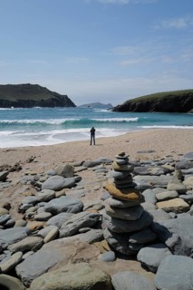 Beautiful weather at a beach on the Dingle peninsula with a view of the island of Inishtooskert