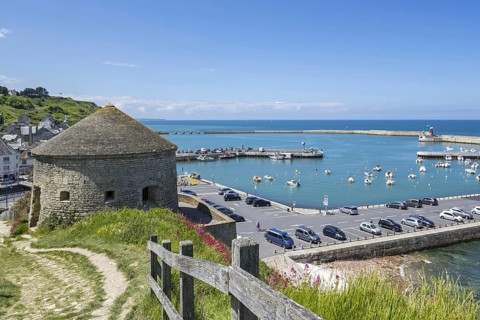 View over the 17th century Tour Vauban tower and the little harbour at Port-en-Bessin-Huppain along the English Channel
