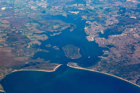 Oblique aerial view through plane window of Brownsea Island