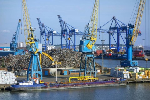 Dock cranes and scrap metal heap in the Aberdeen port