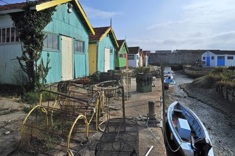 Colourful cabins of oyster farmers in the harbour at Le Chateau-d'Oleron on the island Ile d'Oleron