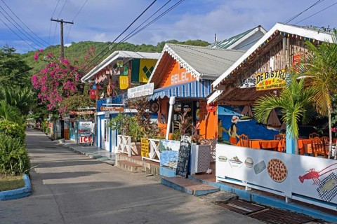 Main street with colourful shops and restaurants in capital town Port Elizabeth on the island Bequia