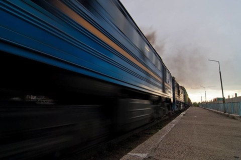Diesel locomotive pulling goods train on the Trans-Mongolian railway line out of Ulanbator towards the south