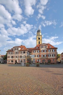 Twin houses and tower of St. John's Minster Church