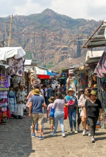 People walking past stalls in the market