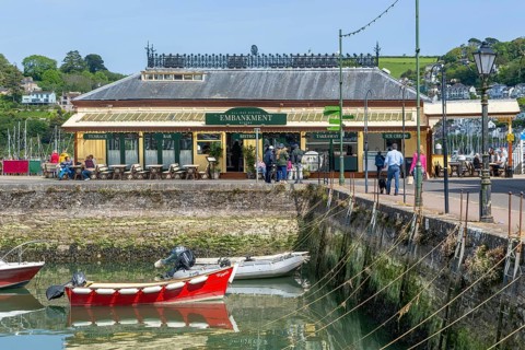 Boats moored in inner harbour view to Embankment cafe bistro