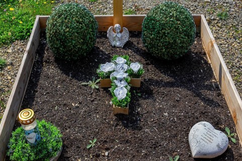 Simple grave with praying angel