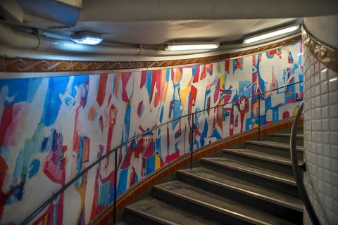 Staircase in the Metro station Abbesses decorated with an abstract painting