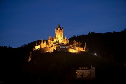 Illuminated Reichsburg Cochem in the evening