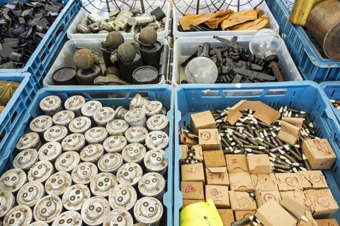 Stand at militaria fair selling World War Two memorabilia like bomb fuzes