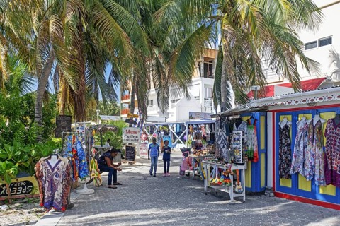 Souvenirs shop and palm trees along boulevard in the capital city Philipsburg of the Dutch island part of Sint Maarten