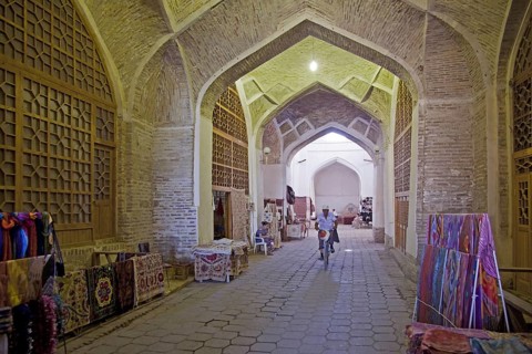 Carpets for sale in the old indoor market of the historic Silk Road town Bukhara