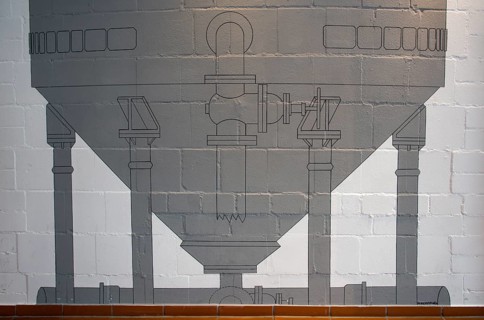 Technical drawing of a kettle on a stone wall