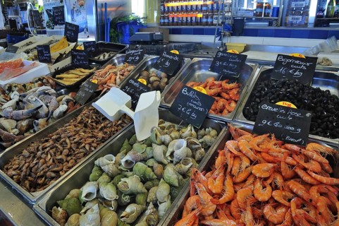 Fresh shellfish and seafood on display at fish market in the port of Le Treport