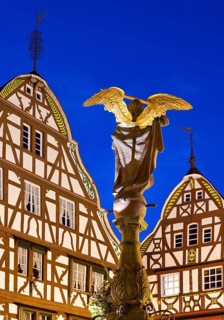 Gabled half-timbered houses with St. Michael's Fountain