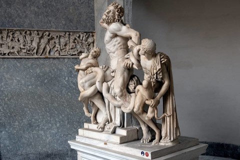 View View from half right on Lacoon group historical sculpture in marble marble sculpture by ancient sculptor Laocoon group of priest Laocoon and sons fights fight with snake