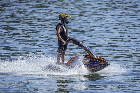 Jet skier riding jet ski