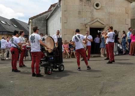 Village fiesta musicians and villagers outside chapel church