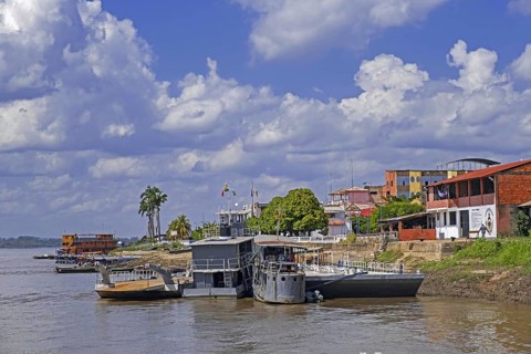 Riverboats moored along riverbank of the Mamore River at the city Guayaramerin in the Amazon