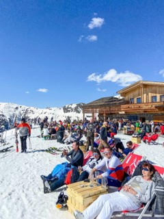 Sunbathing in front of the Vider Alp mountain restaurant