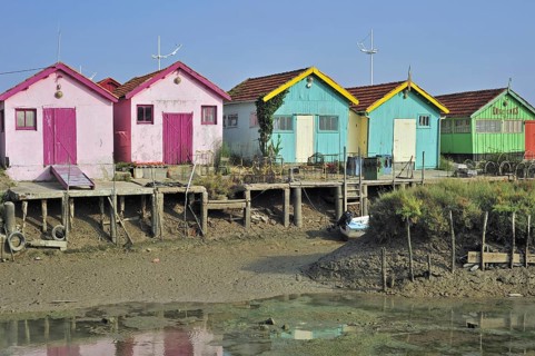 Colourful cabins of oyster farmers in the harbour at Le Chateau-d'Oleron on the island Ile d'Oleron