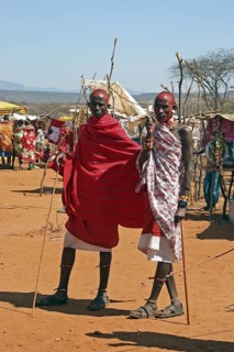 Portrait of Samburu warriors in traditional red dress at market