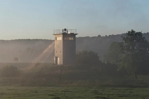Former GDR border tower in the early morning mist in the Elbe floodplain near Darchau in the Elbe River Landscape UNESCO Biosphere Reserve. Amt Neuhaus