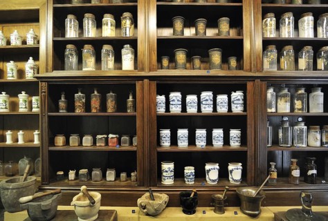 Apothecary cabinet of old pharmacy showing pots and jars with medicines in the Orval Abbey