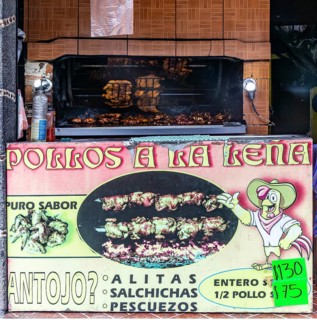 Grilled chicken street cooking on rotary grill