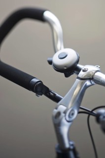 Close up of bike bell mounted on trekking bars