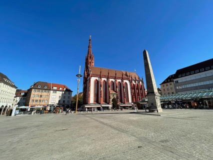 Gothic Lady Chapel on the market square with fountain obelisk