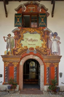 Entrance and facade with Lueftl painting at the town hall and registry office in Ruhpolding